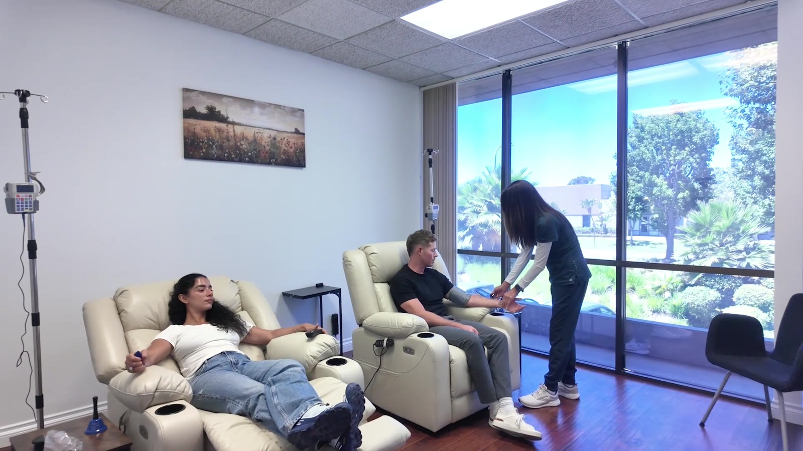 A nurse tending to patients in the infusion suite
