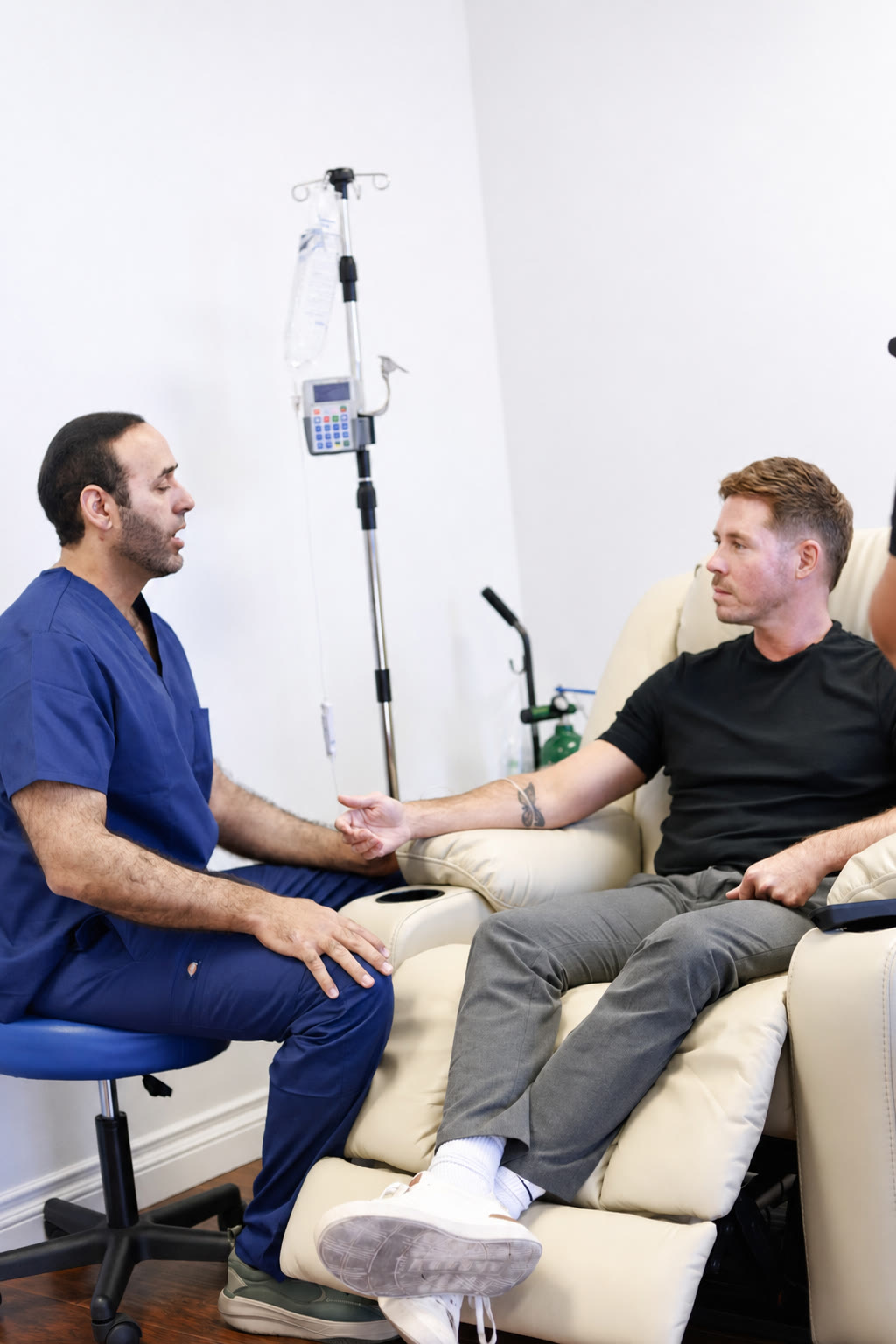 A ClinIVoy nurse in consultation with a patient